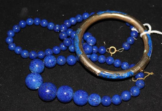 A lapis lazuli necklace and bangle.